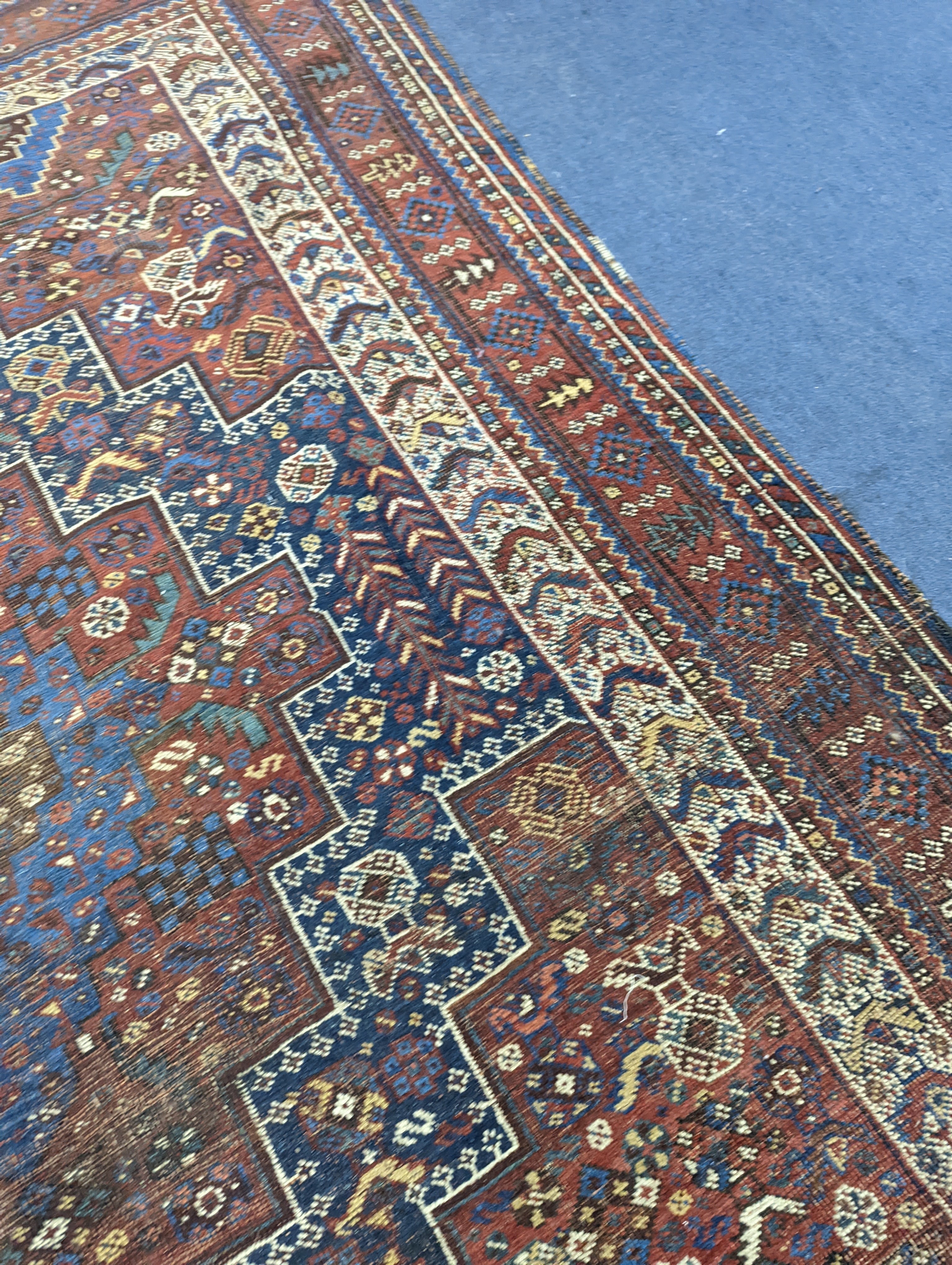 A Caucasian red ground rug and a Belouch rug, larger 200 x 165cm